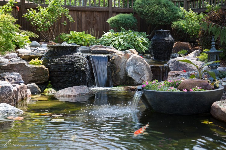 Garden ecosystem pond with aquascape water feature fountains